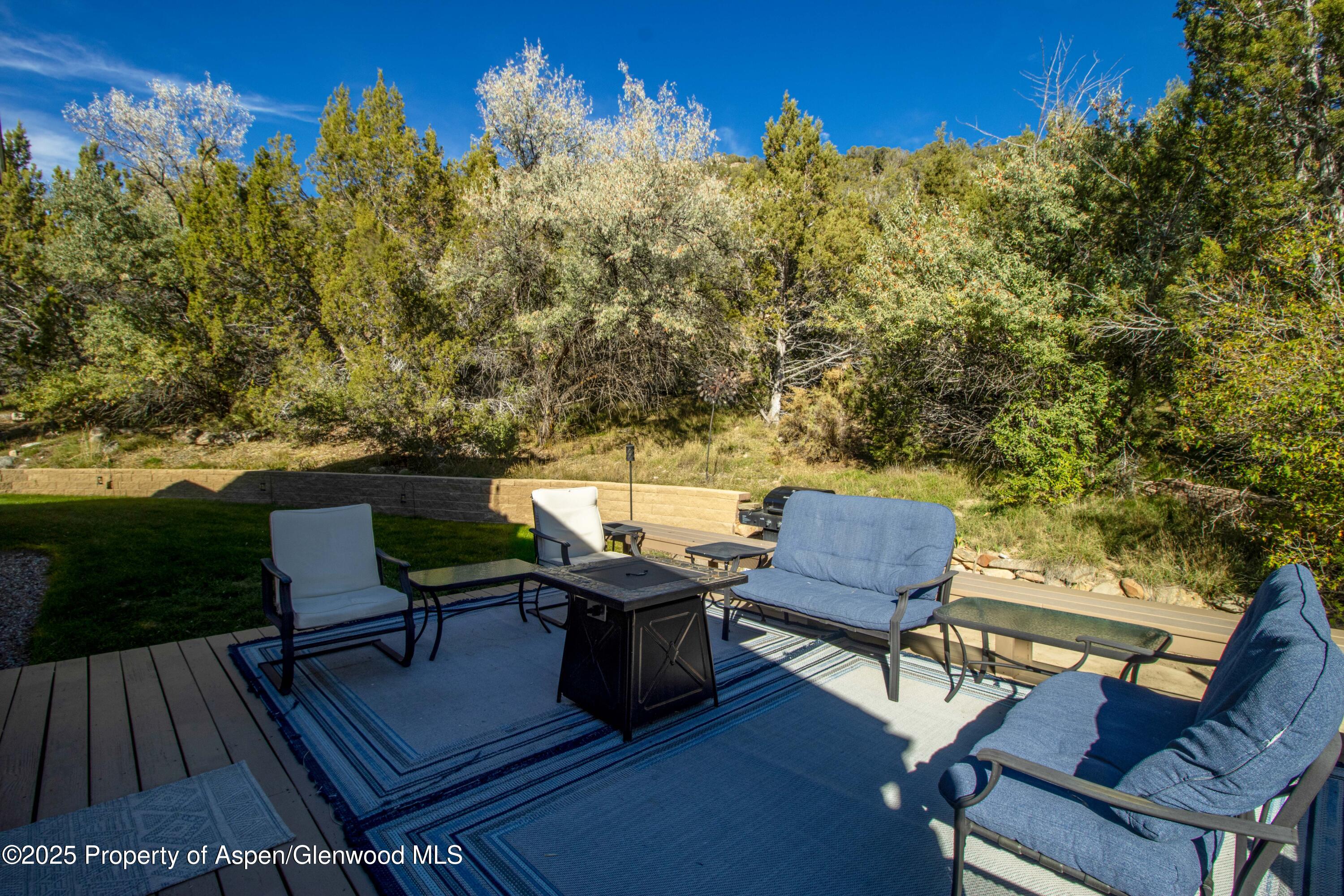 1849 Odin Drive Silt, CO 81652 - Photo 6 of 28 a view of a chairs and table in patio with a lake view