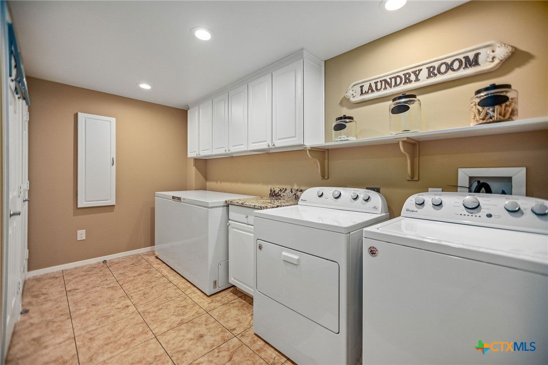 265 Coastal Oaks Loop Port O'Connor, TX 77982 - Photo 21 of 48 a storage room with washer and dryer
