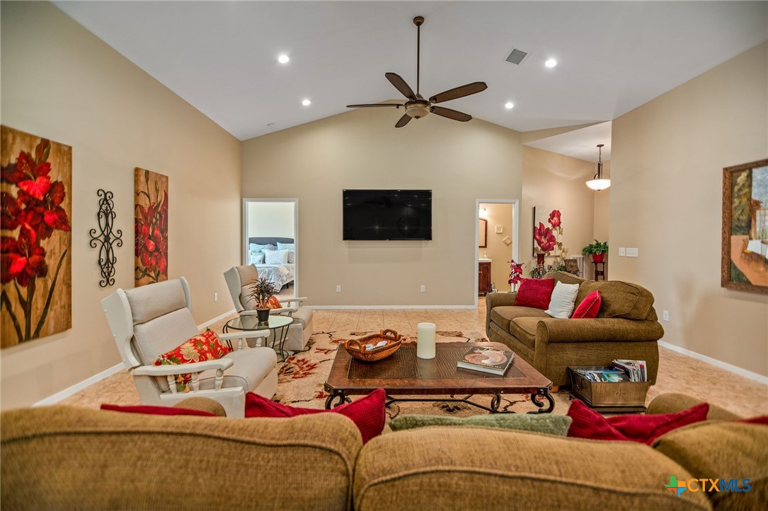 265 Coastal Oaks Loop Port O'Connor, TX 77982 - Photo 25 of 48 a living room with furniture and a flat screen tv