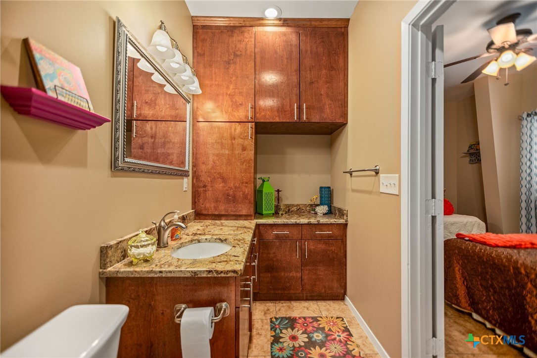 265 Coastal Oaks Loop Port O'Connor, TX 77982 - Photo 28 of 48 a bathroom with a sink and a mirror