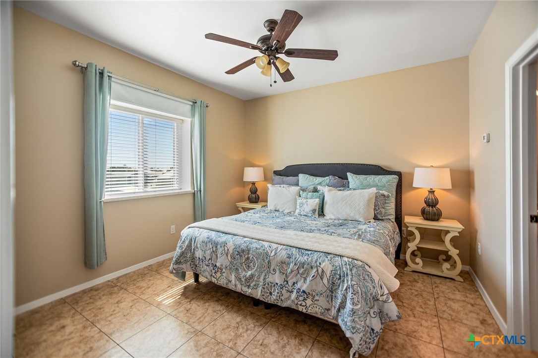 265 Coastal Oaks Loop Port O'Connor, TX 77982 - Photo 33 of 48 a bedroom with a bed and window