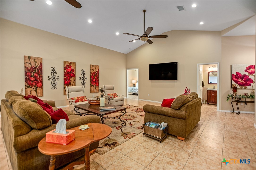 265 Coastal Oaks Loop Port O'Connor, TX 77982 - Photo 6 of 48 a living room with furniture and a flat screen tv