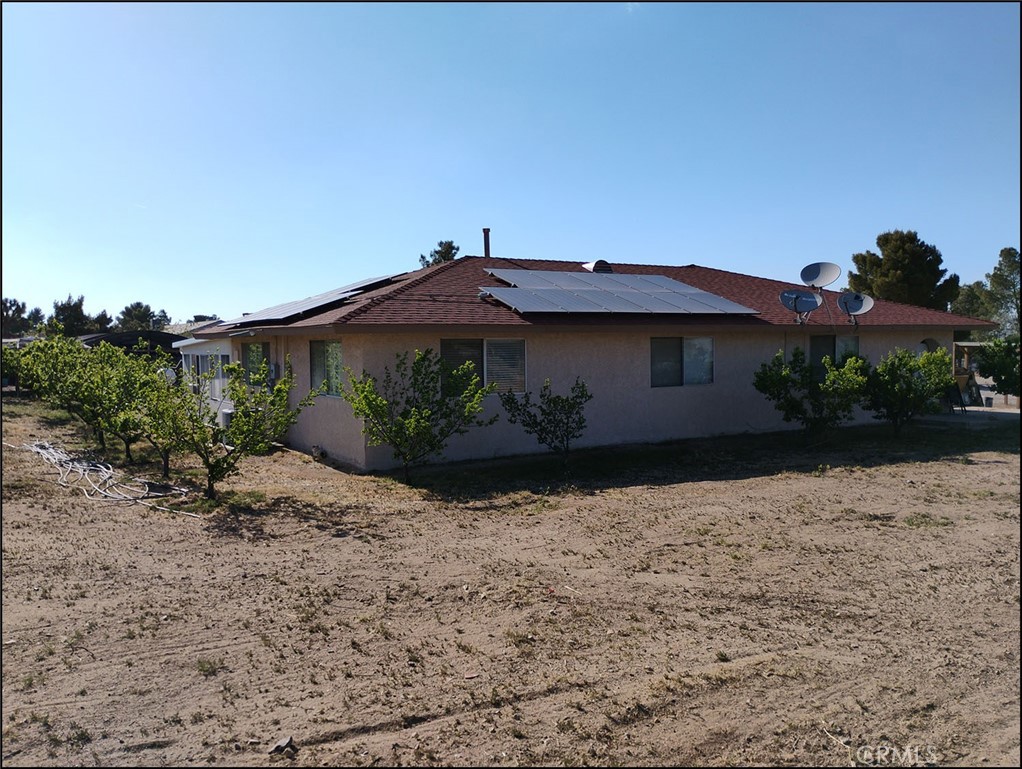 4077 Amador Road Phelan, CA 92371 - Photo 11 of 40 a front view of a house with a yard