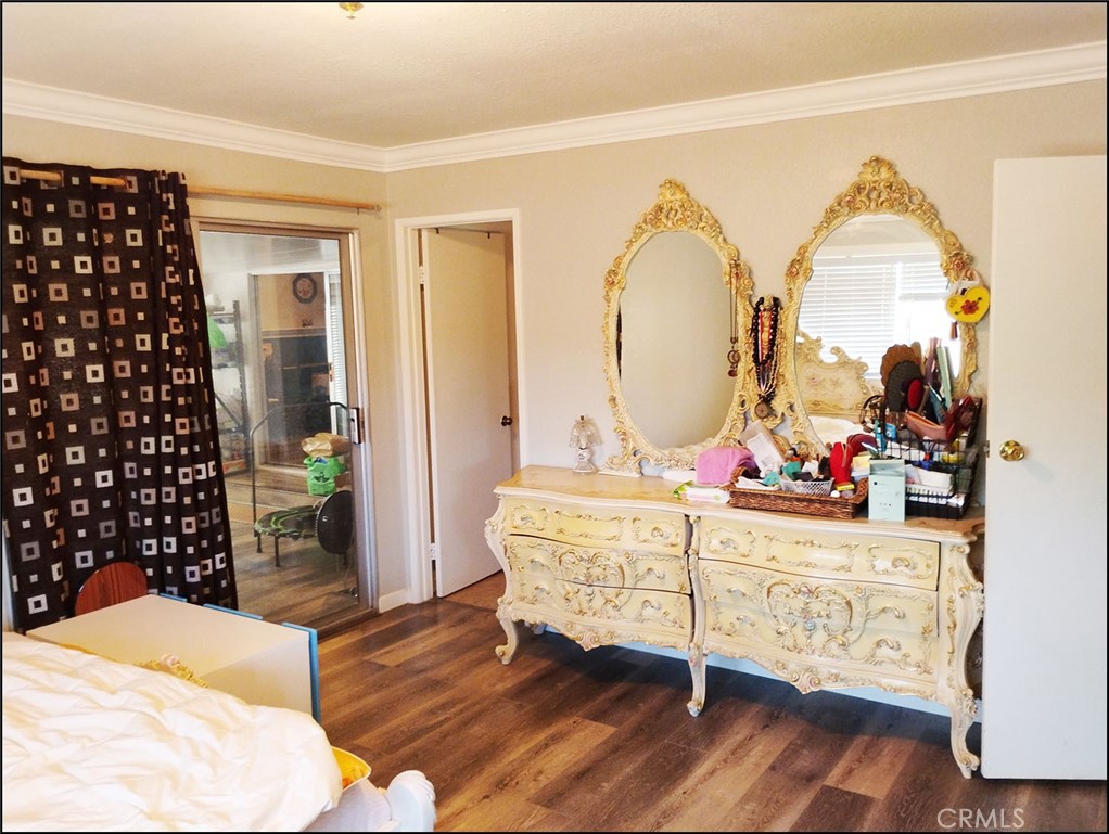 4077 Amador Road Phelan, CA 92371 - Photo 14 of 40 a living room with a bed furniture and a large window