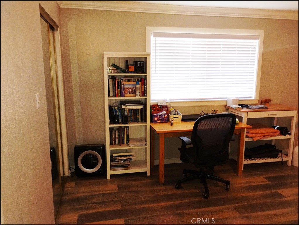 4077 Amador Road Phelan, CA 92371 - Photo 17 of 40 a view of a workspace with furniture and a window