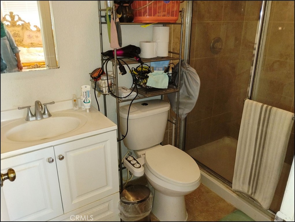 4077 Amador Road Phelan, CA 92371 - Photo 20 of 40 a bathroom with a sink toilet and shower