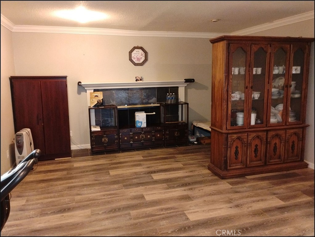 4077 Amador Road Phelan, CA 92371 - Photo 27 of 40 a view of an empty room with wooden floor