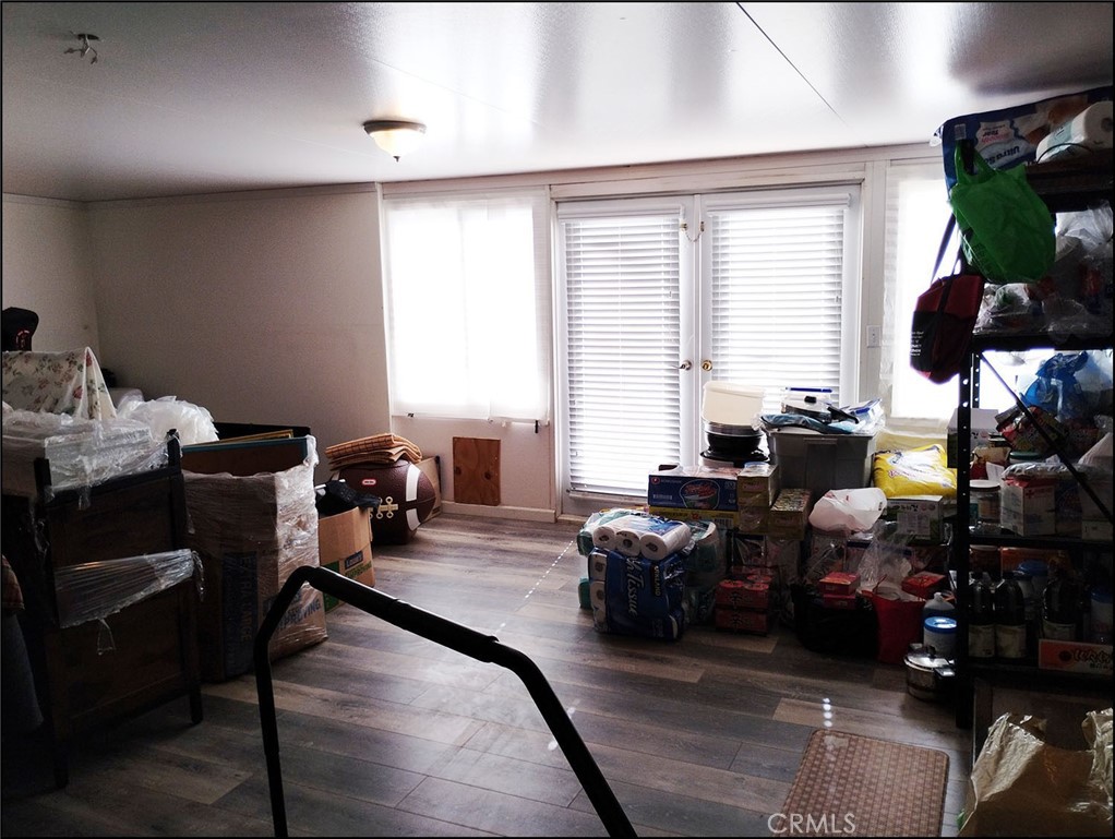 4077 Amador Road Phelan, CA 92371 - Photo 31 of 40 a living room with furniture fireplace and a potted plant