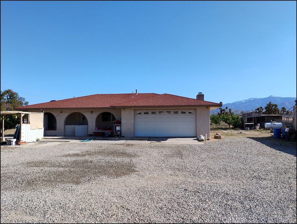 4077 Amador Road Phelan, CA 92371 - Photo 8 of 40 a front view of a house with a yard