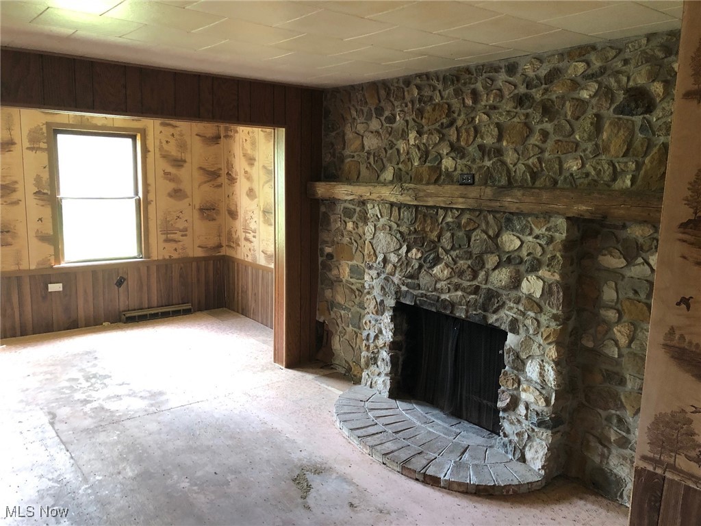 23550 Sandy Creek Road Minerva, OH 44657 - Photo 3 of 14 Living room with stone fireplace