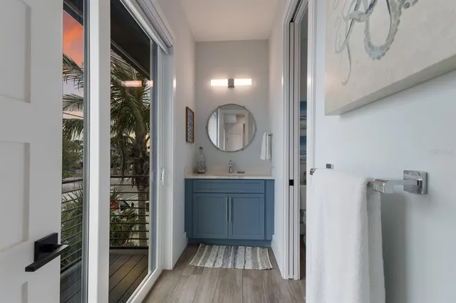 a bedroom with a large bed and a large window