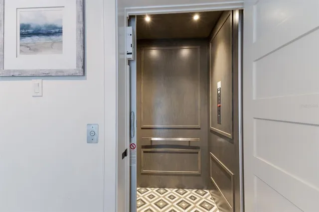 a view of elevator with hallway