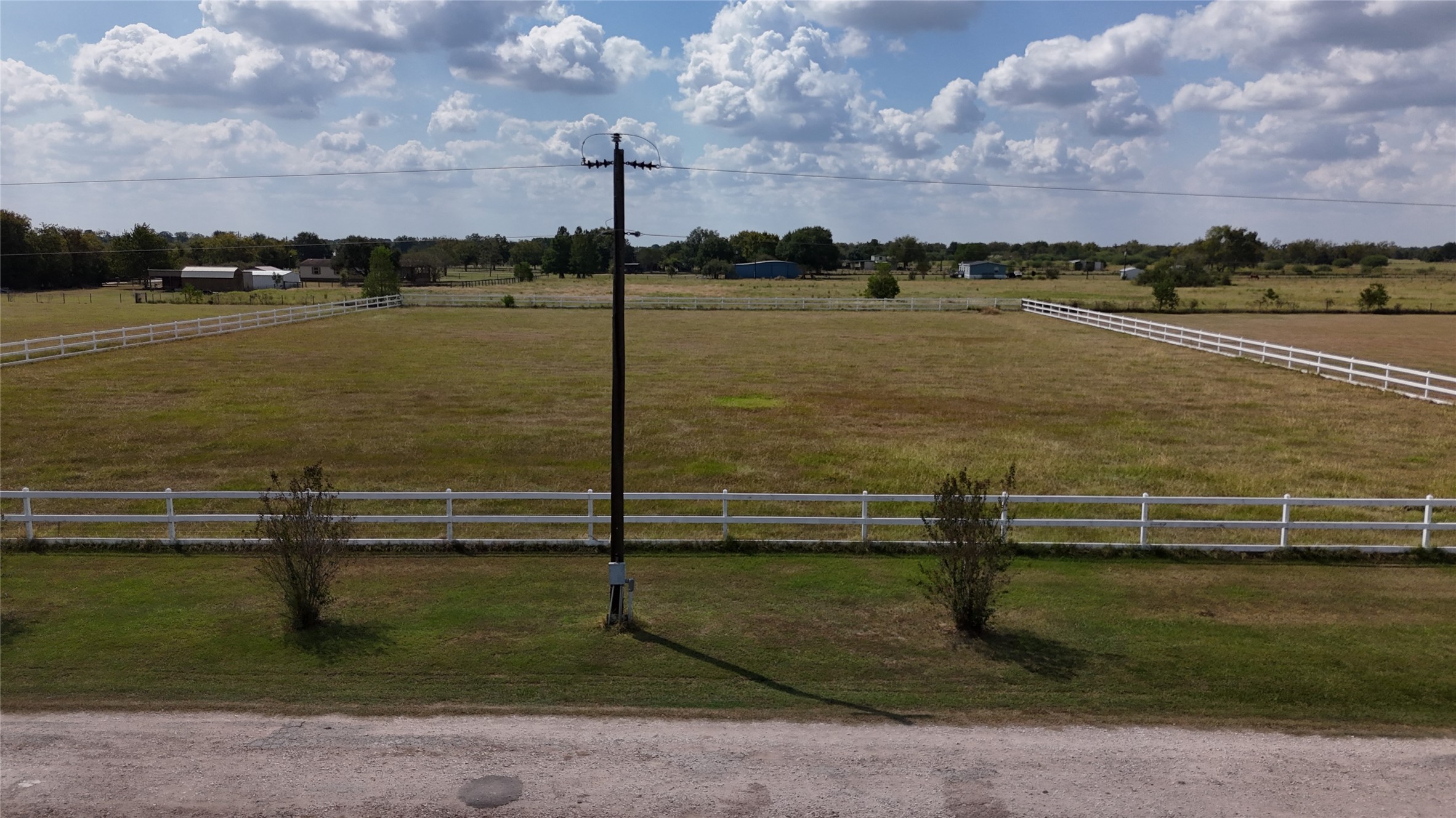 7223 Neiman Road Brookshire, TX 77423 - Photo 12 of 22 a view of a lake with a table and wooden bridge