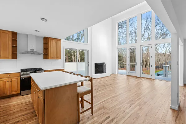 a hall with cabinets and wooden floor