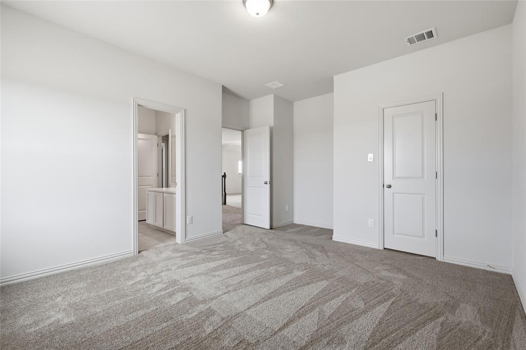 3737 Pitchfork Terrace Anna, TX 75409 - Photo 20 of 33 Spacious room with light gray patterned carpet and white walls