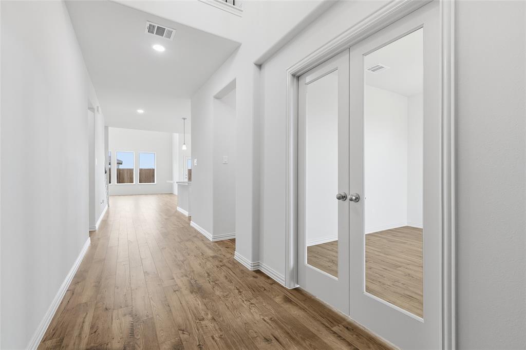 3737 Pitchfork Terrace Anna, TX 75409 - Photo 3 of 33 Entryway featuring wood-finish flooring, white baseboards, and a neutral wall palette