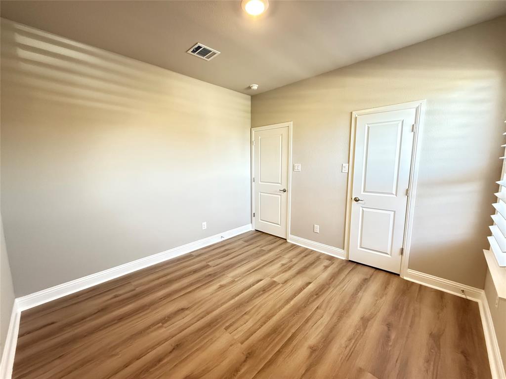 3476 Evergreen Way Midlothian, TX 76065 - Photo 13 of 22 Unfurnished bedroom with light wood-type flooring and baseboards