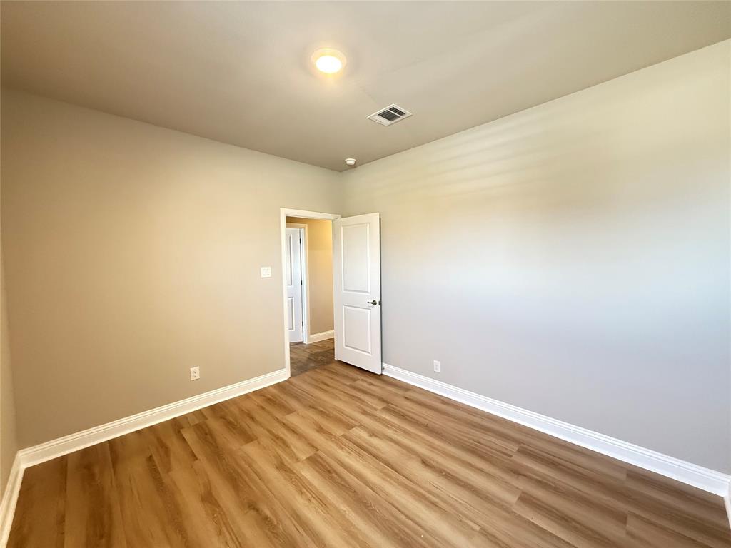 3476 Evergreen Way Midlothian, TX 76065 - Photo 14 of 22 Empty room with baseboards and wood finished floors