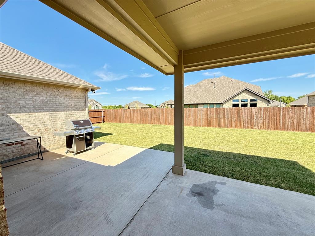 3476 Evergreen Way Midlothian, TX 76065 - Photo 19 of 22 Fenced backyard with a patio and grilling area