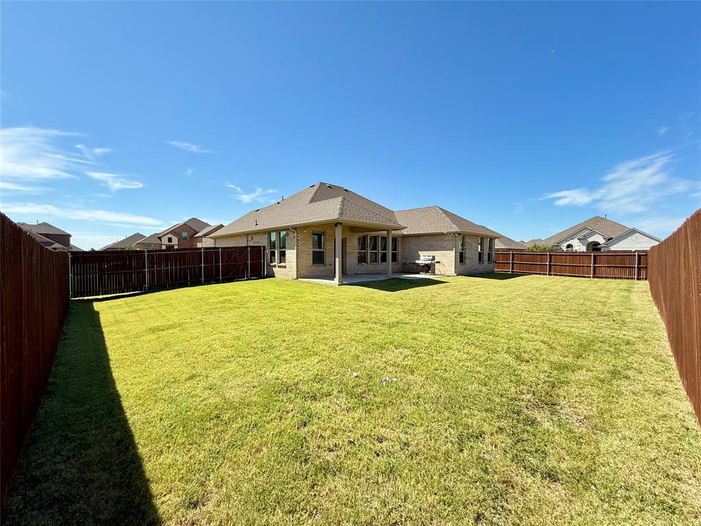 3476 Evergreen Way Midlothian, TX 76065 - Photo 20 of 22 Rear view of property with a patio area, a shingled roof, brick siding, and a fenced backyard