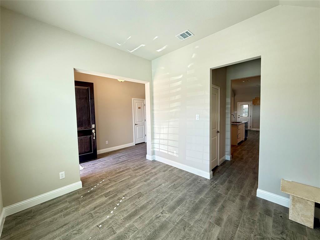 3476 Evergreen Way Midlothian, TX 76065 - Photo 3 of 22 Empty room featuring baseboards and wood finished floors