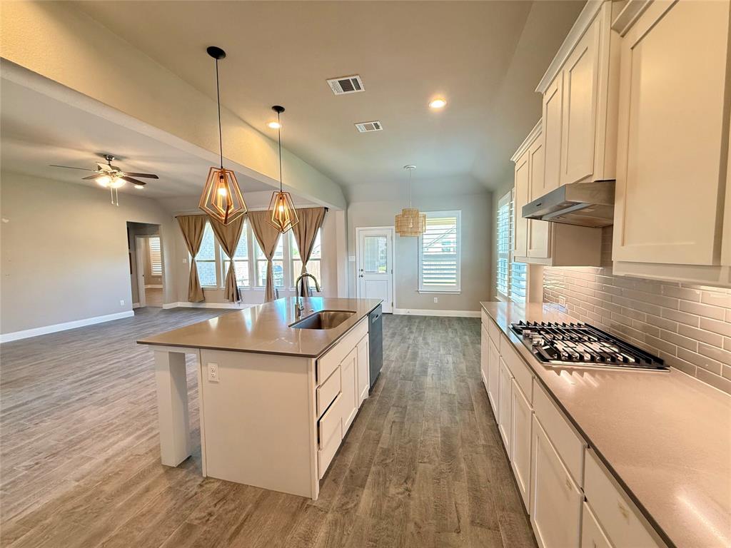 3476 Evergreen Way Midlothian, TX 76065 - Photo 22 of 22 Kitchen featuring white cabinets, backsplash, open floor plan, decorative light fixtures, and recessed lighting