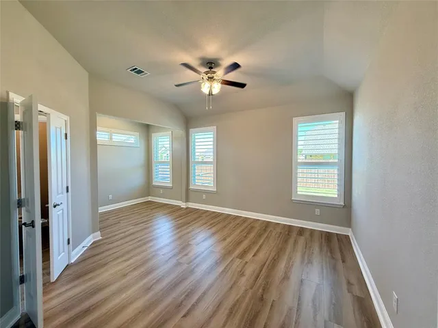 a kitchen with stainless steel appliances granite countertop a stove and cabinets