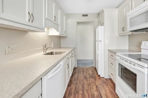 a view of empty room with a fireplace