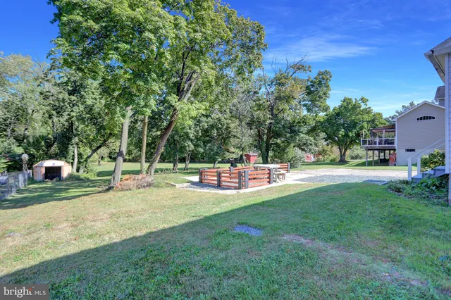 a view of yard with patio