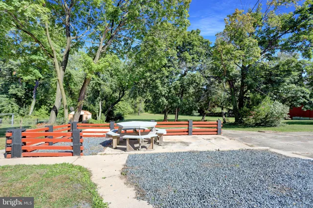a porch with a yard in back