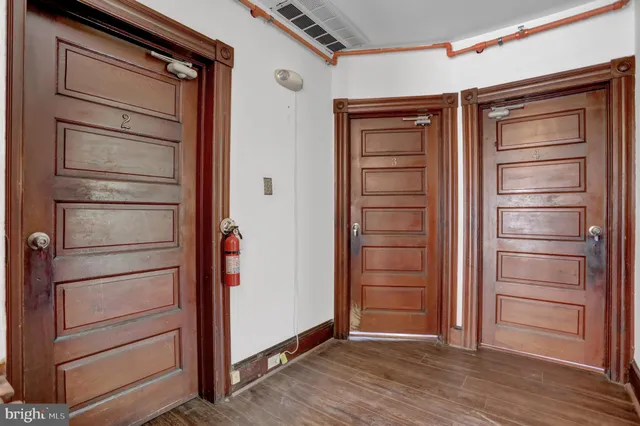 a view of empty room with wooden ceiling