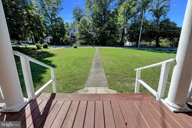 a view of a patio with a table chairs