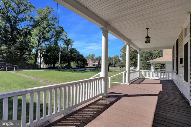 a porch with seating space and yard