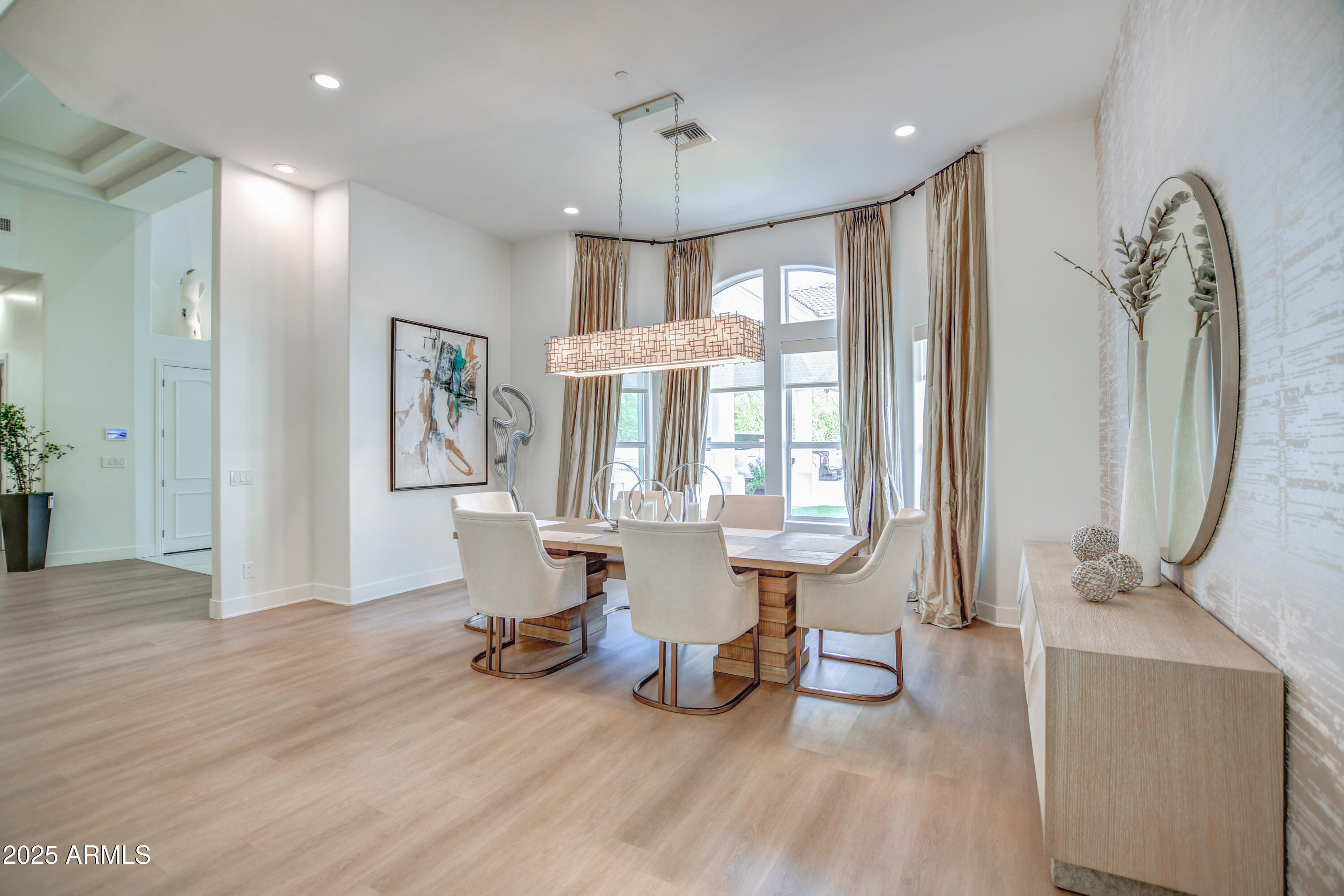 10651 East Cactus Road Scottsdale, AZ 85259 - Photo 23 of 126 a view of a livingroom with furniture wooden floor and a chandelier