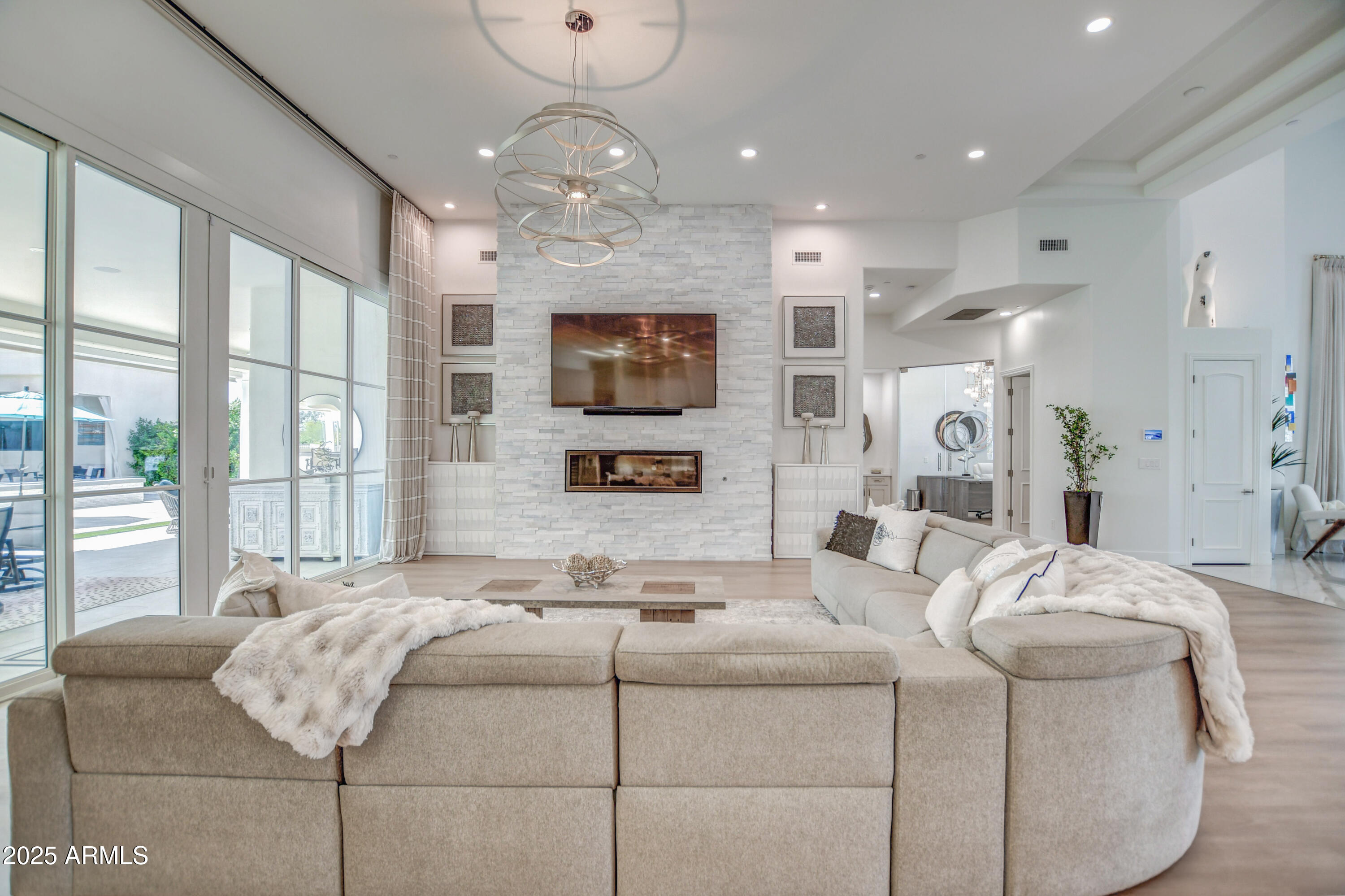 10651 East Cactus Road Scottsdale, AZ 85259 - Photo 39 of 126 a living room with furniture fireplace and flat screen tv