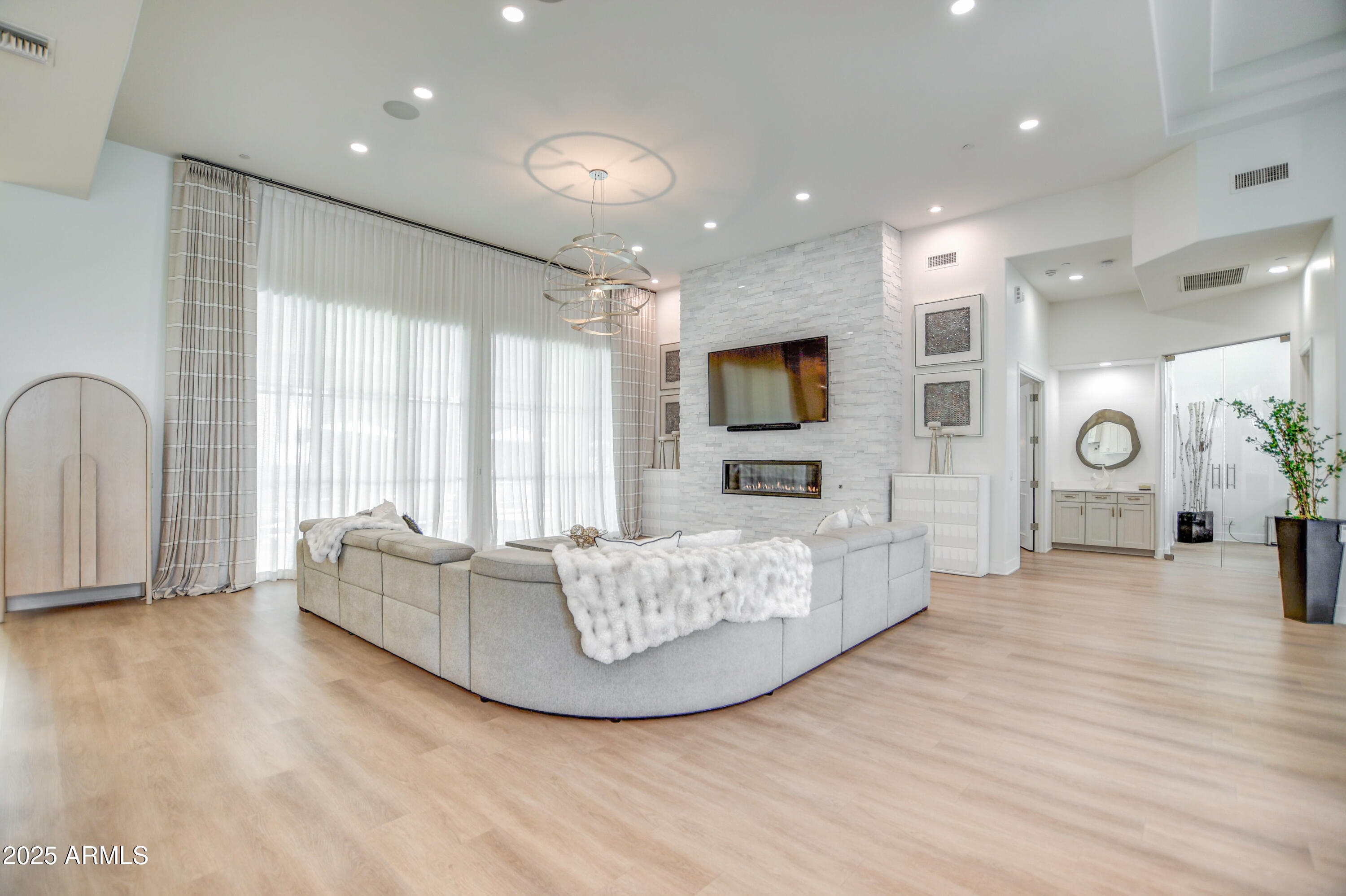 10651 East Cactus Road Scottsdale, AZ 85259 - Photo 40 of 126 a living room with fireplace furniture and a flat screen tv