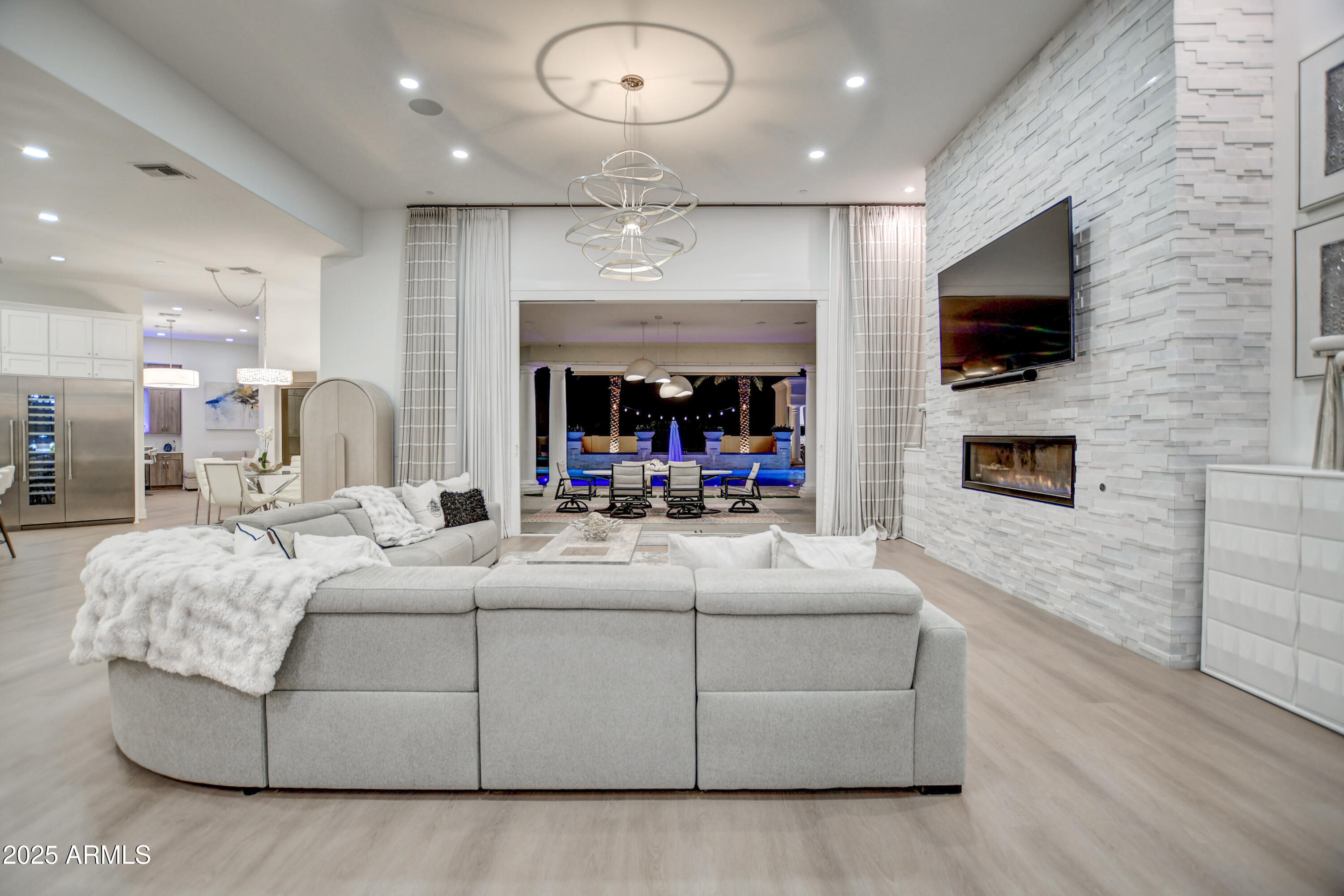 10651 East Cactus Road Scottsdale, AZ 85259 - Photo 46 of 126 a living room with furniture and a flat screen tv