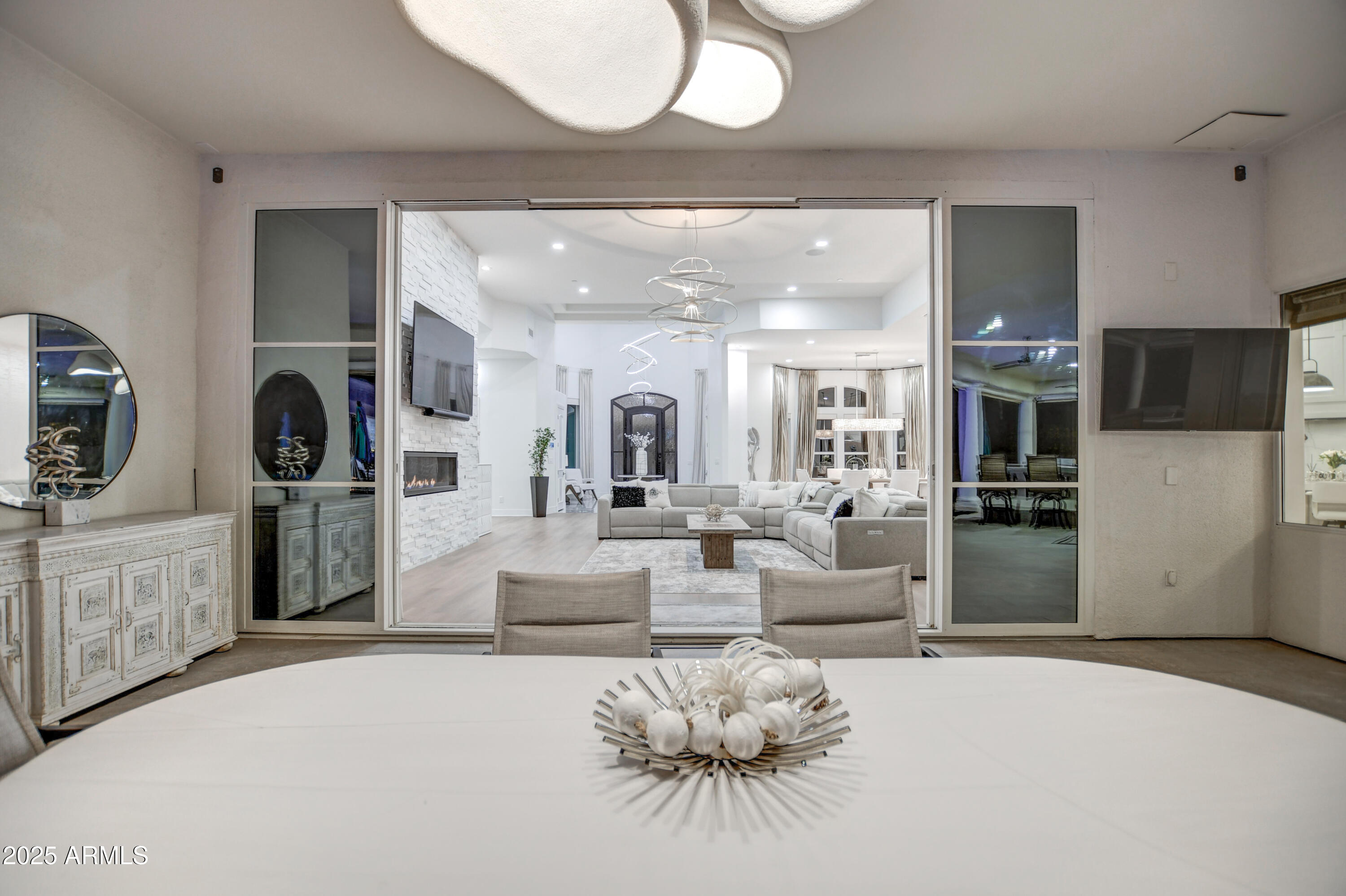 10651 East Cactus Road Scottsdale, AZ 85259 - Photo 53 of 126 a living room with furniture a flat screen tv and kitchen view