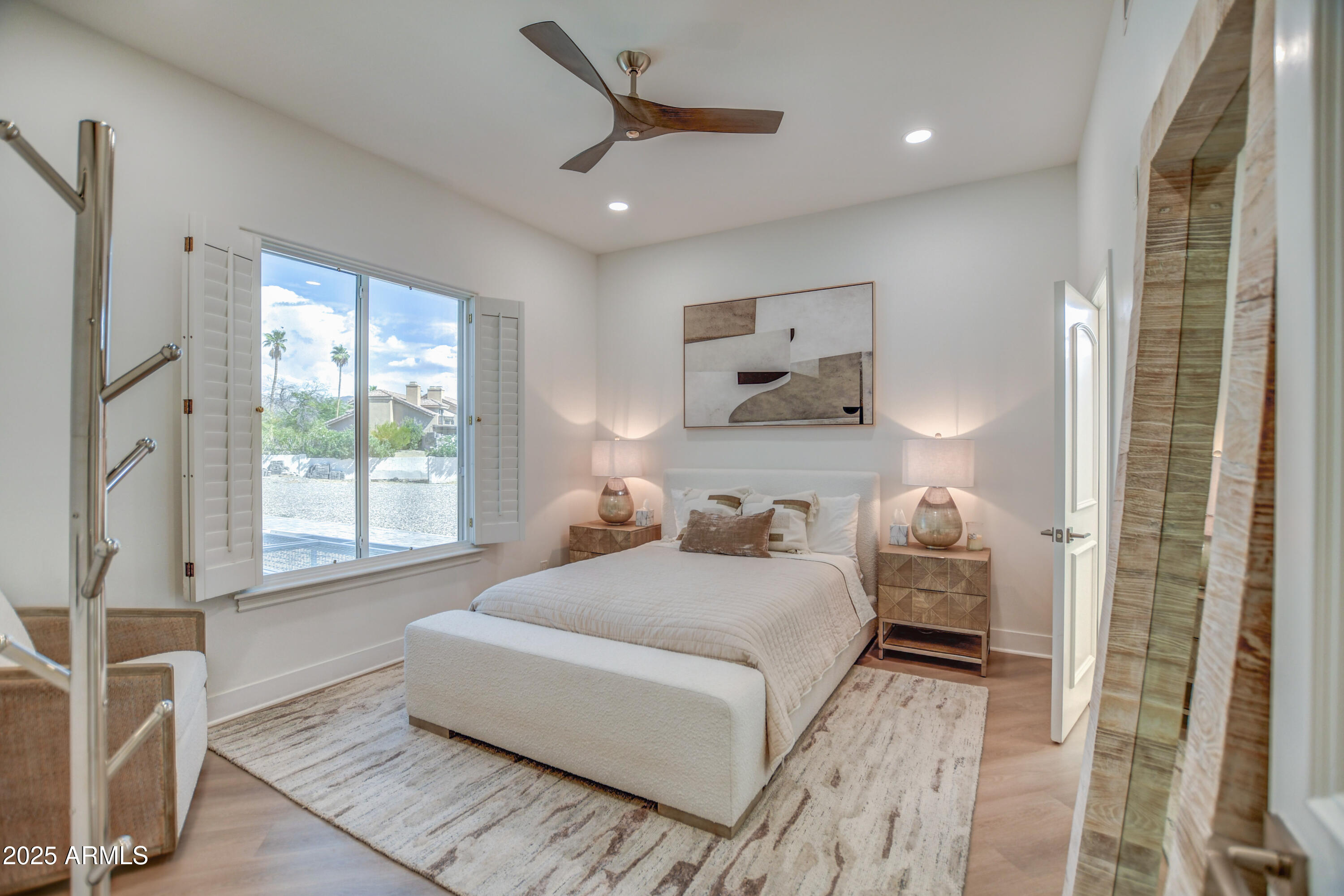10651 East Cactus Road Scottsdale, AZ 85259 - Photo 82 of 126 a bedroom with a bed and a large window