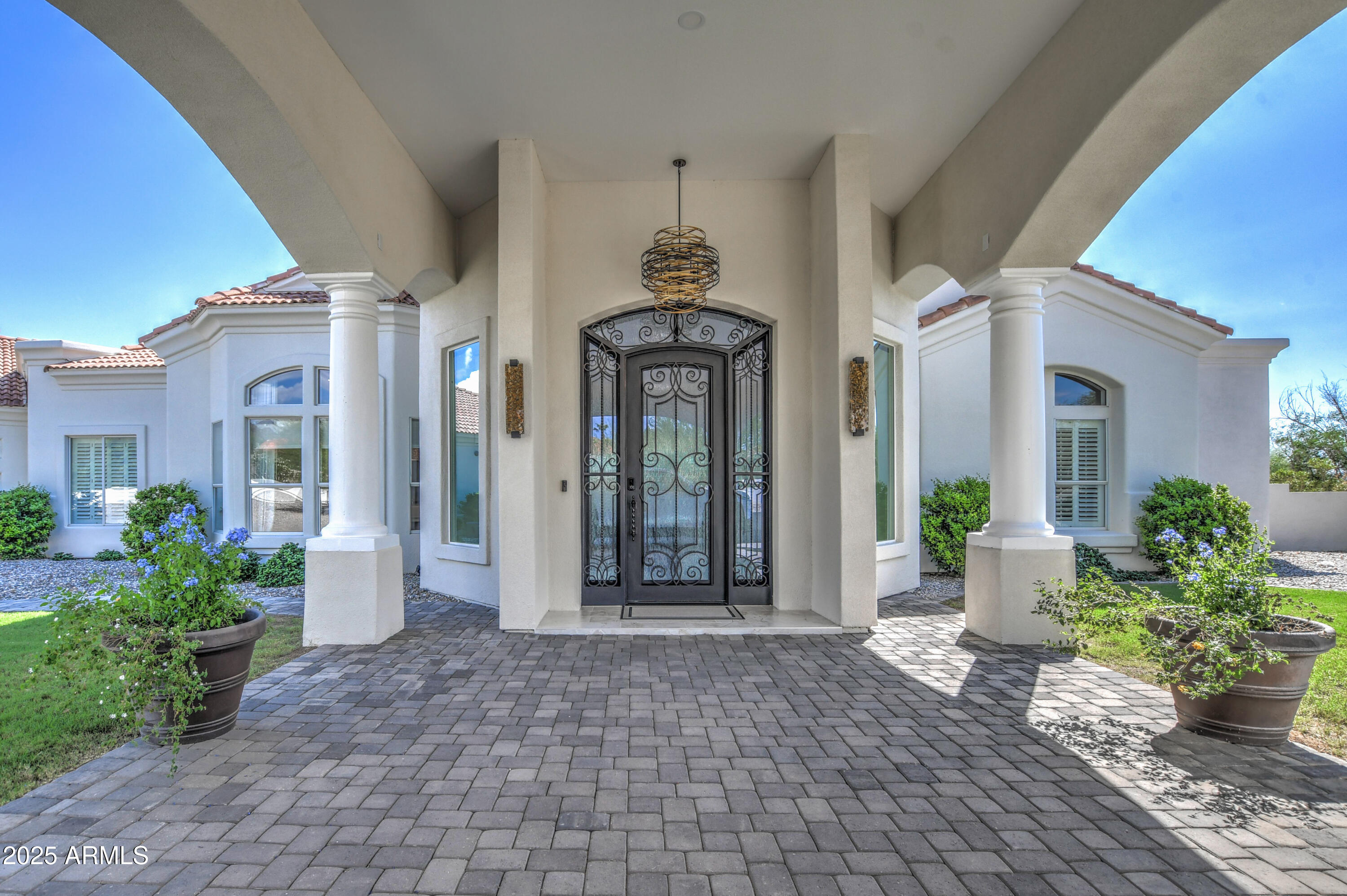 10651 East Cactus Road Scottsdale, AZ 85259 - Photo 9 of 126 a front view of a house with a porch