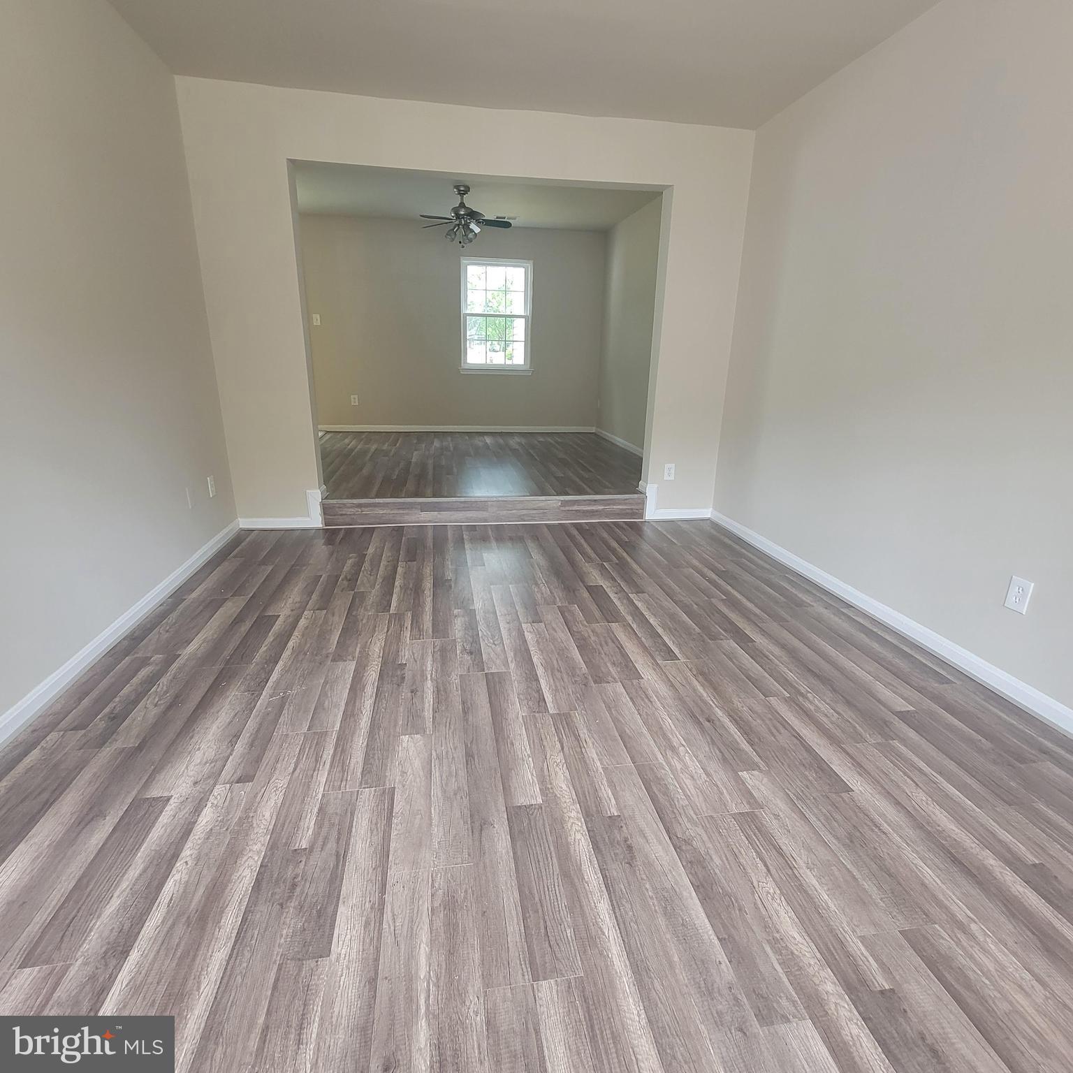 3381 Ryon Court Waldorf, MD 20601 - Photo 3 of 12 a view of empty room with wooden floor and fan