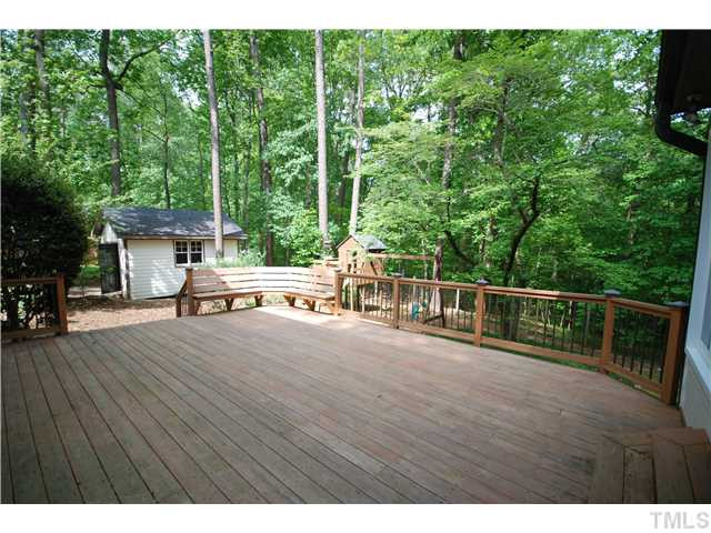 8304 Heel Stone Court Raleigh, NC 27613 - Photo 19 of 25 The newly remolded deck features built-in seating and wood/metal handrails. The perfect place for entertaining! Patio/Deck