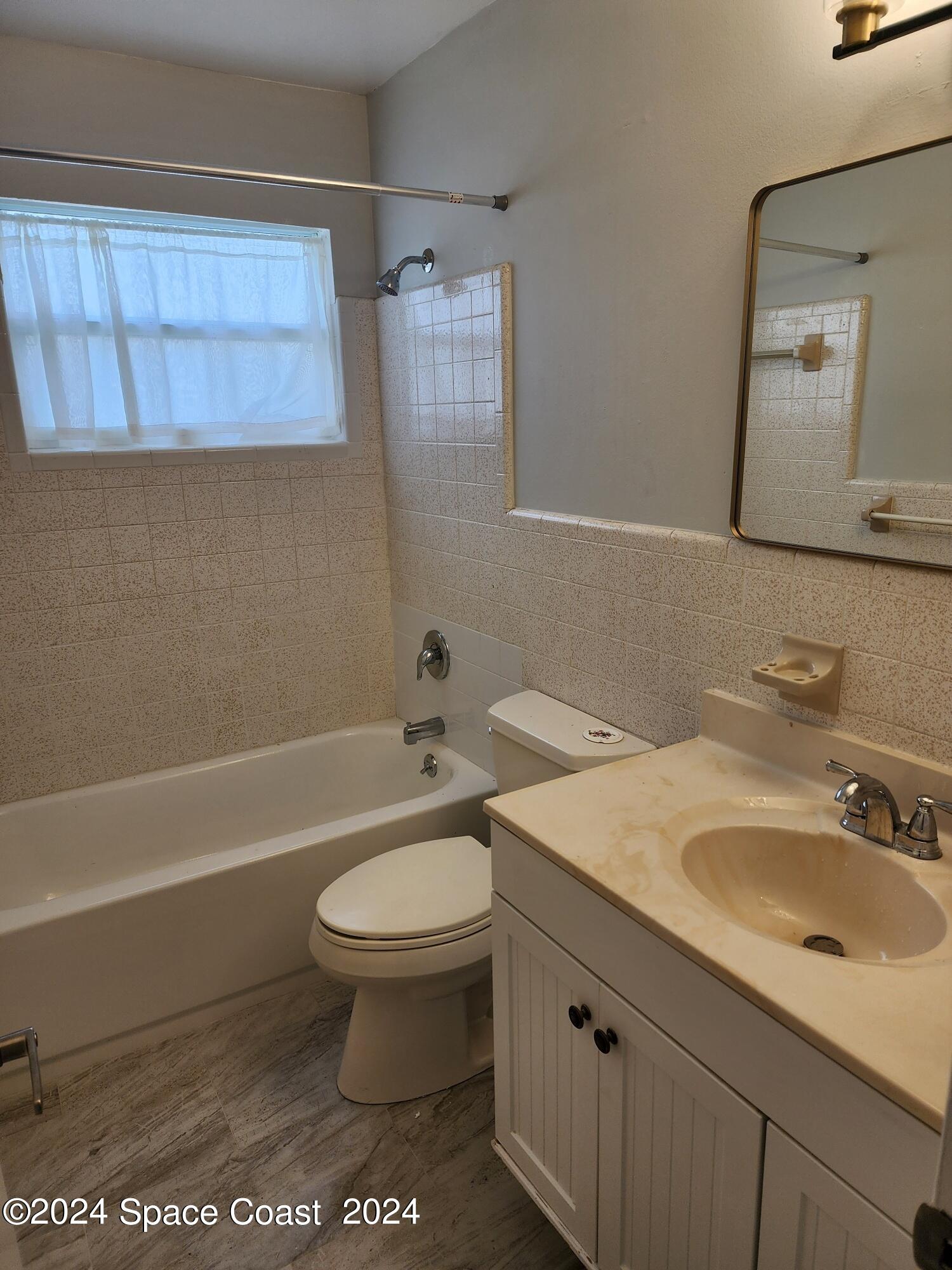 1725 Reef Court Merritt Island, FL 32952 - Photo 16 of 26 a bathroom with a sink toilet and shower