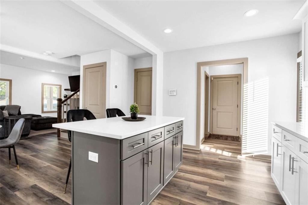 128 Nathan Road Southwest Atlanta, GA 30331 - Photo 14 of 36 a view of a kitchen counter top space with furniture and wooden floor