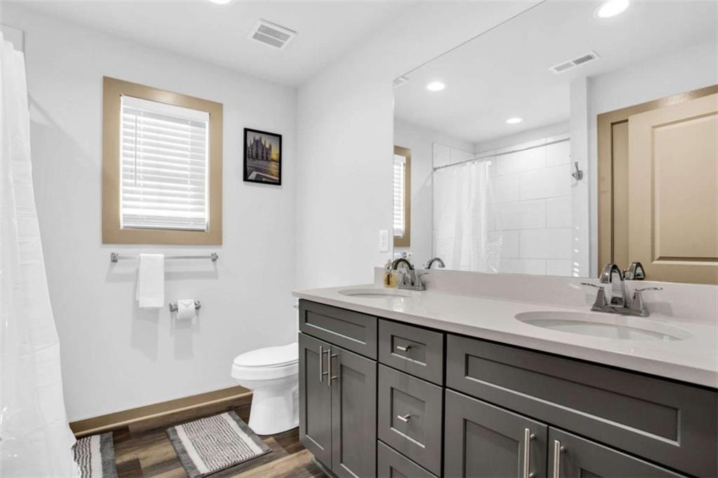 128 Nathan Road Southwest Atlanta, GA 30331 - Photo 20 of 36 a bathroom with a sink a toilet and a mirror