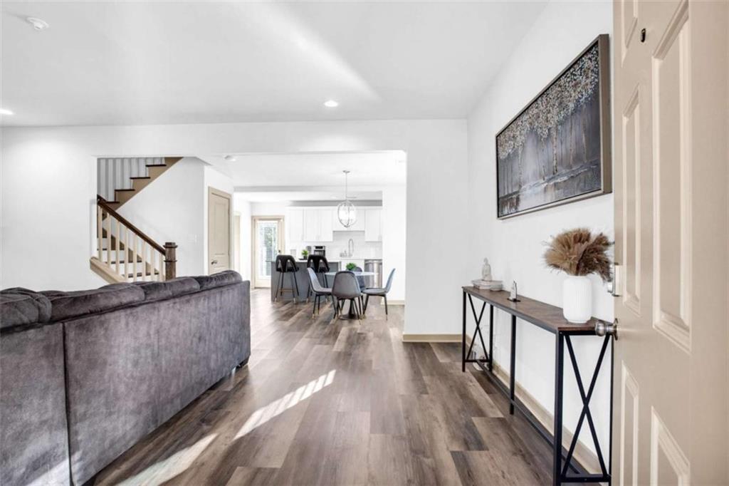 128 Nathan Road Southwest Atlanta, GA 30331 - Photo 2 of 36 a living room with furniture and wooden floor