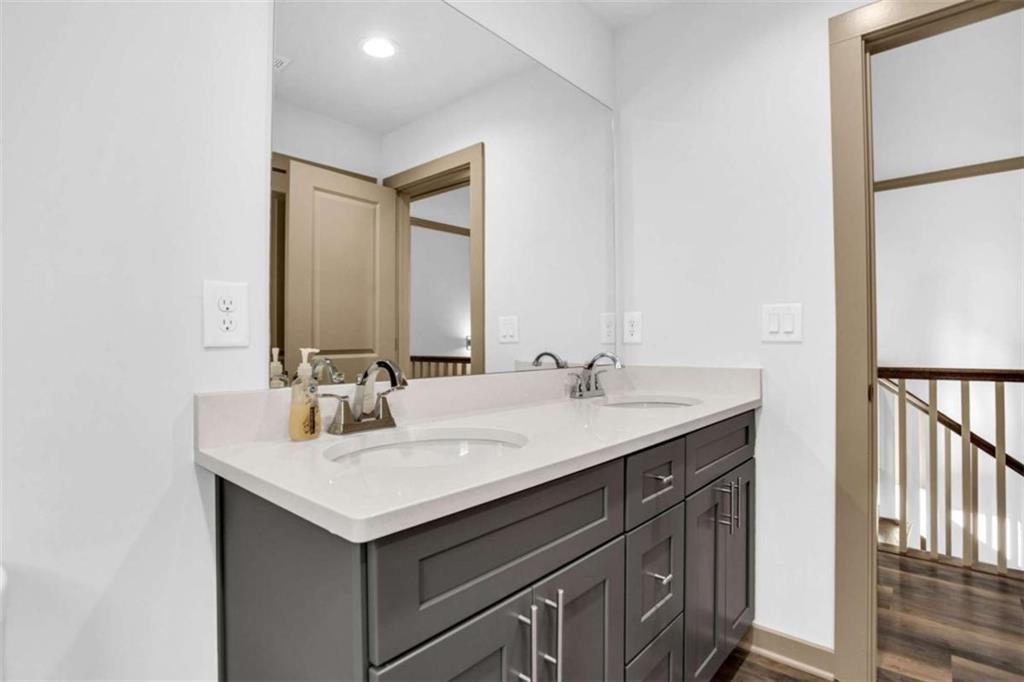 128 Nathan Road Southwest Atlanta, GA 30331 - Photo 22 of 36 a bathroom with a sink and a mirror