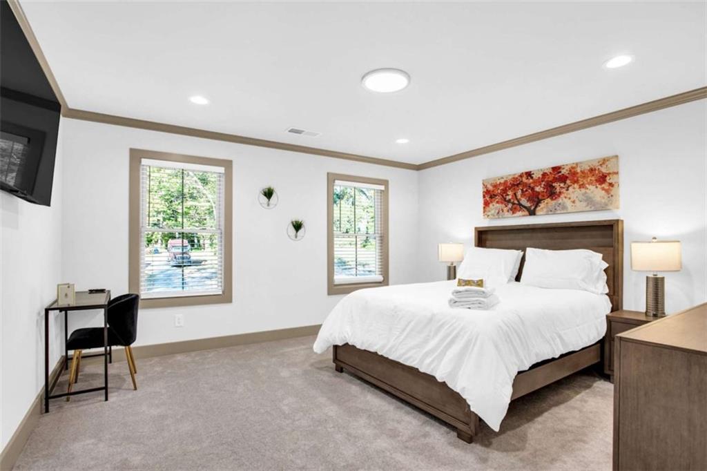 128 Nathan Road Southwest Atlanta, GA 30331 - Photo 27 of 36 a bedroom with a large bed and a window