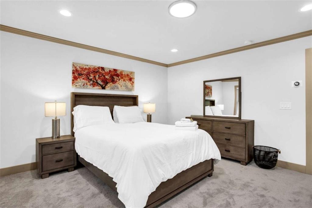 128 Nathan Road Southwest Atlanta, GA 30331 - Photo 28 of 36 a bedroom with a bed and a painting on the wall