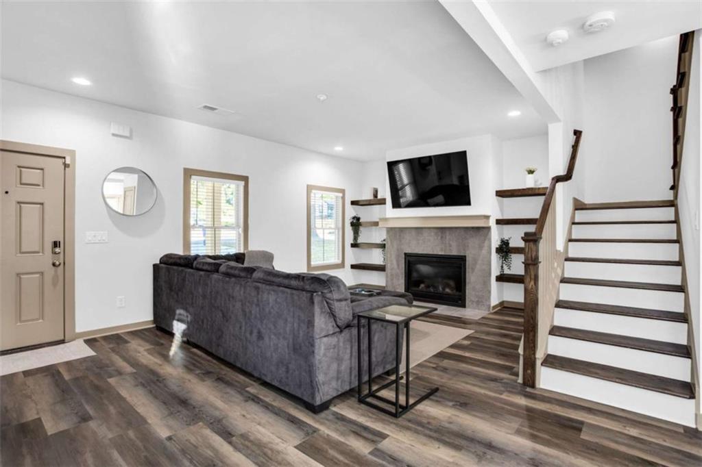128 Nathan Road Southwest Atlanta, GA 30331 - Photo 3 of 36 a living room with furniture and a fireplace